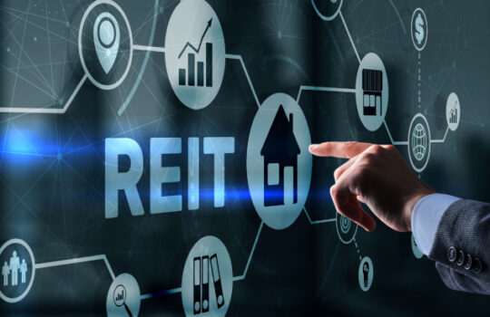 REIT Hand pressing button on screen