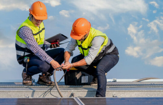 engineers ware uniform working on roof inspect and check solar