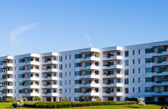 Modern white danish residential condominium building near Copenhagen, Denmark on a sunny day.