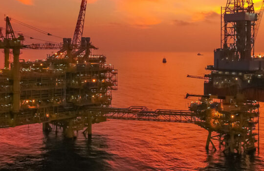 Areal photography from top view of jack up rig scenery with blue
