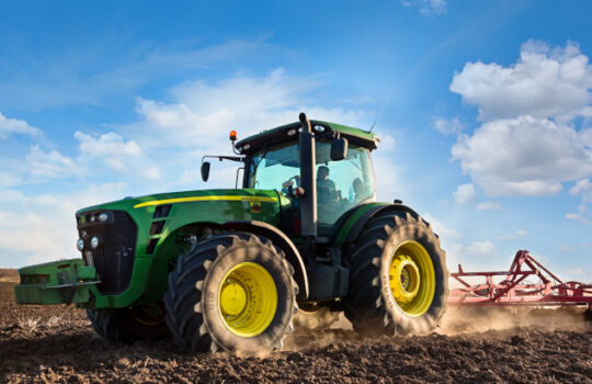 Varna, Bulgaria - March 5, 2017 Ploughing a field with John Deere 6930 tractor. John Deere was manufactured in 1995-1999 and it has JD 7.6L or 8.1L 6-cyl diesel engine.
