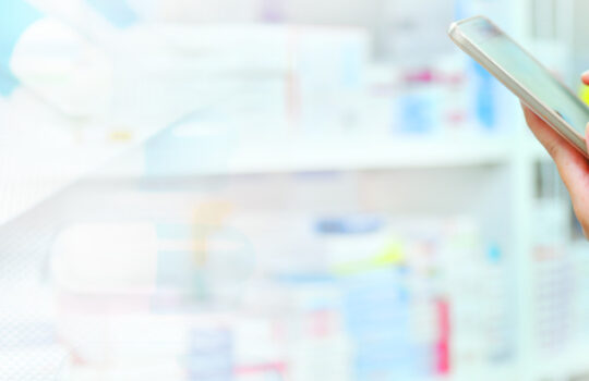 Pharmacist holding computer tablet Using for filling prescriptio