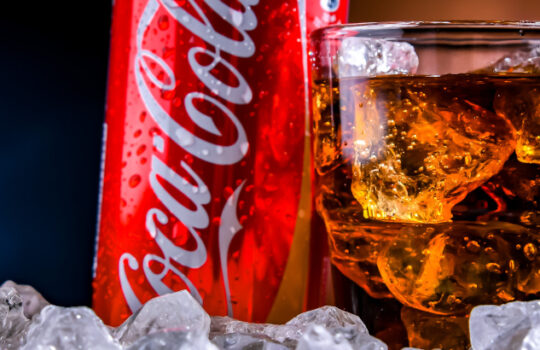 POZNAN, POL - NOV 24, 2022: Can of Coca-Cola, a carbonated soft drink manufactured by The Coca-Cola Company headquartered in Atlanta, Georgia, USA
