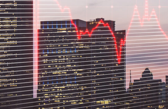 Real estate market crisis concept with red falling graph and city on background, double exposure
