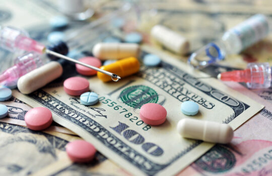 Biotech Pharma ASMB Assembly Biosciences high costs of expensive medication concept , money and syringe
