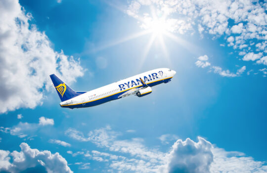 Bremen, Airport - August, 19, 2023. airplane flying in the sky. Ryan Air Airline, Airplane in the blue sky with clouds. close up. high flying passenger plane. jet plane flying in sky with sunbeam.