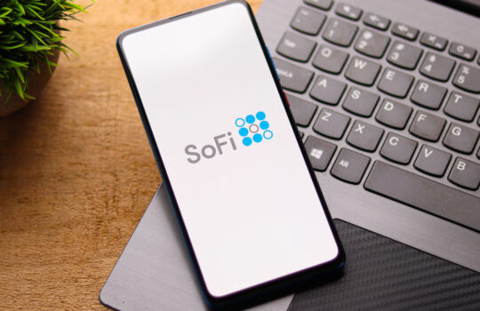 SoFi logo on phone screen stock image.