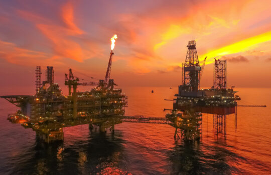 Areal photography from top view of jack up rig scenery with blue ocean view.