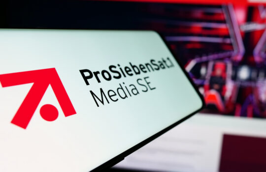 Stuttgart, Germany - 03-15-2024: Cellphone with logo of German television company ProSiebenSat.1 Media SE in front of business website. Focus on center-left of phone display.