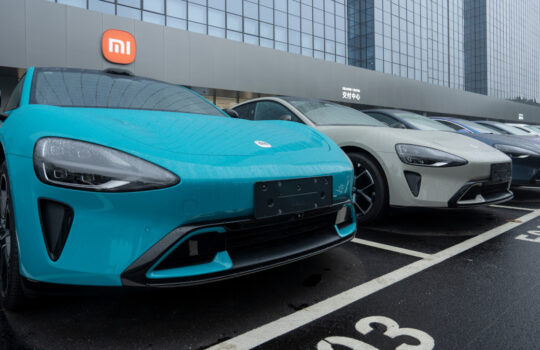 Shenzhen, Guangdong, China - Apr 8, 2024: Rows of Xiaomi's new Su7 electric cars are seen at its delivery and service center in Shenzhen, Guangdong Province, China.