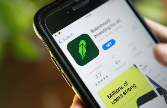 Bangkok, Thailand - January 29, 2021 : An iPhone user downloading Robinhood App, a stock trading app, from the App Store.
