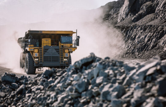 Career dump truck is going to the gold mining range.