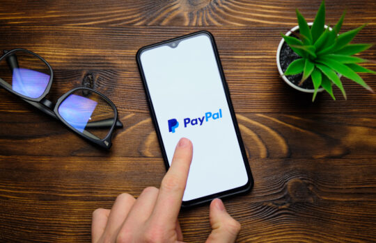 paypal electronic payment system on the phone display. russia, st.petersburg, 8 december 2020.