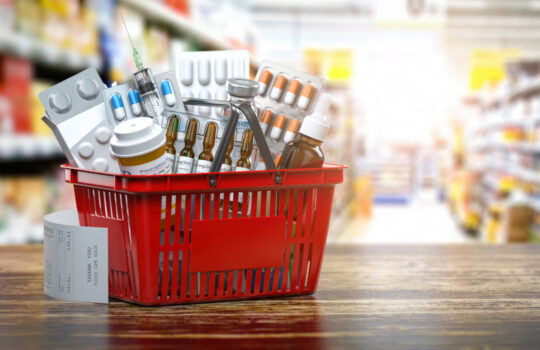 Purchasing medicines in pharmacy drugstore. Shopping basket full of medicines, pills and blisters. 3d illustration