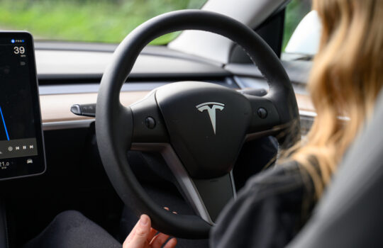 Close-Up on Tesla Vehicle Steering Wheel