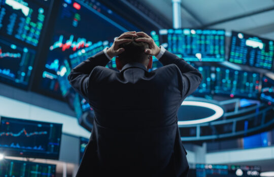 Stressed Stock Exchange Trader Can't Apprehend a Sudden Stock Market Collapse. Financial Crisis Concept with Stock Broker Saddened by Negative Ticker Information, Red Graphs and Real-Time Data