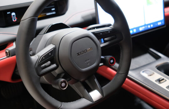 Shanghai,China-March 31st 2024: inside of Xiaomi SU7 electric car. Car logo on steering wheel