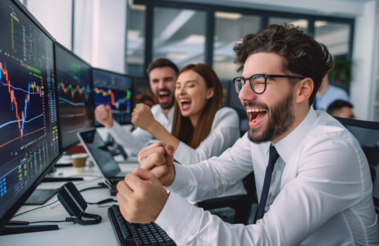 Successful stock traders celebrating. Ideal for financial services, team success stories, and corporate achievement themes.