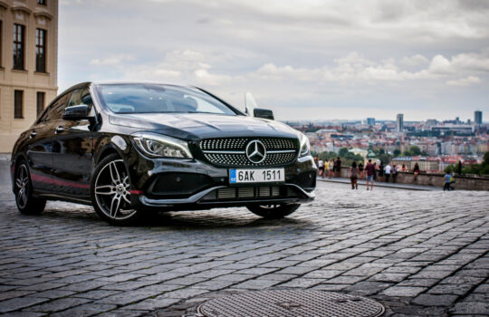 PRAGUE,THE CZECH REPUBLIC, 31.8.2017: Closeup of Mercedes Benz CLA 45 AMG, black car with red sports strips. Rare view of car