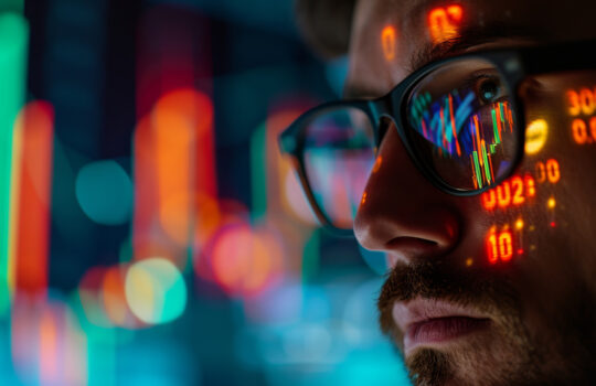 Stock Market Trader Working Investment Charts, Graphs, Ticker, Diagrams Projected on His Face and Reflecting in Glasses. Financial Analyst and Digital Businessman Selling Shorts and Buying Longs