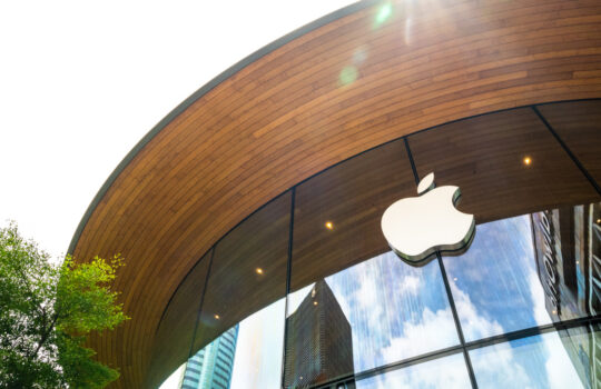 Bangkok, Thailand - October 1, 2024: Close up of Apple logo on the glass wall of an Apple Central World round official store in the city center. Biggest American multinational computer corporation