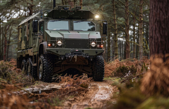 British army Mastiff 6x6 protected patrol vehicle in a woodland close up