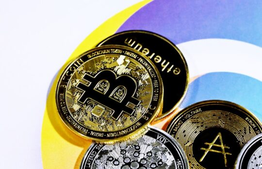 a pile of bitcoins sitting on top of each other