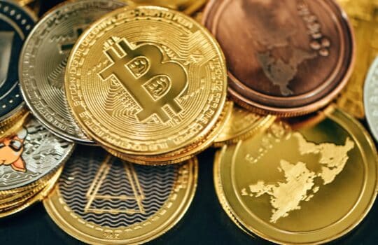 a pile of gold and silver bitcoins