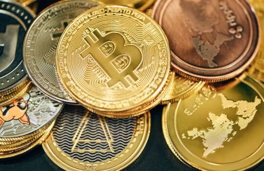 a pile of gold and silver bitcoins