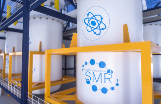 concept of a SMR small modular nuclear reactor power plant on a sunny day. SMR is a future energy concept. 3d rendering.