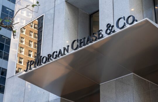 'JPMorgan Chase & Co.' signage on the facade of a modern office building