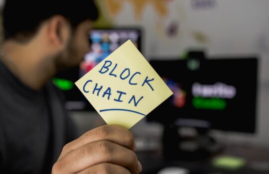 person holding sticky note