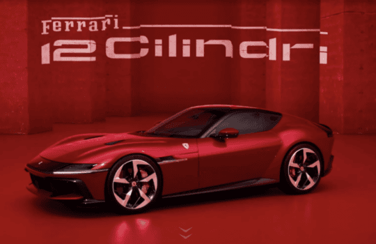Red Ferrari sports car in a red showroom with a bold 'Ferrari 12 Cylinders' display on the wall behind it.