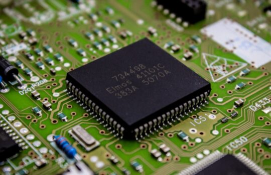 a close up of a computer chip on a printed circuit board
