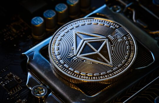 a close up of a computer chip with a symbol on it