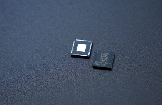 a couple of microchips sitting on top of a table