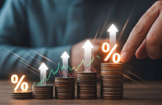 Stacks of coins increasing from left to right with upward arrows and glowing percentage signs, suggesting financial growth and investment gains.