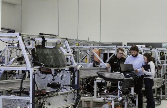 engineers working in automotive factory