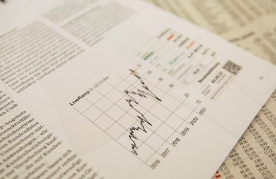 financial newspaper with stock chart