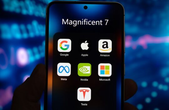 Smartphone screen showing a folder titled Magnificent 7 with icons for Google, Apple, Amazon, Meta, Nvidia, Microsoft, and Tesla.
