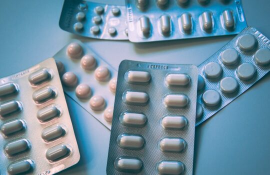 white and blue medication pill blister pack