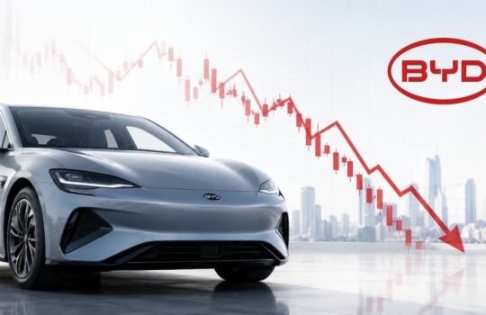 Silver BYD sedan in the foreground with a red downward-trending stock chart and city skyline in the background, signaling stock decline.