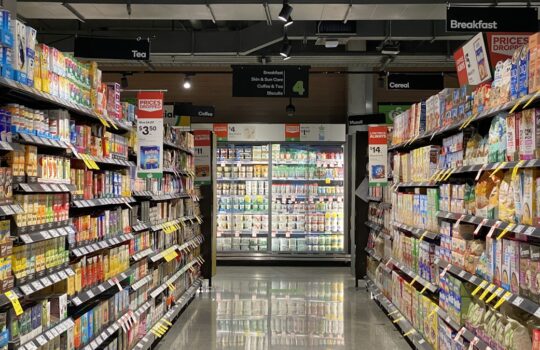 grocery store aisle with stocked shelves
