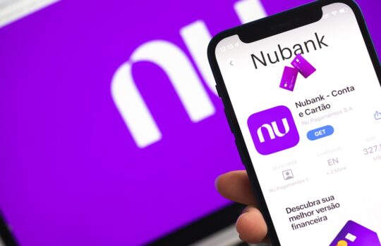 Smartphone screen displaying the Nubank app page with a purple Nu icon and white app interface on a vibrant purple background