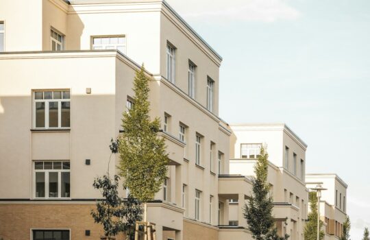 A row of apartment buildings sitting next to each other