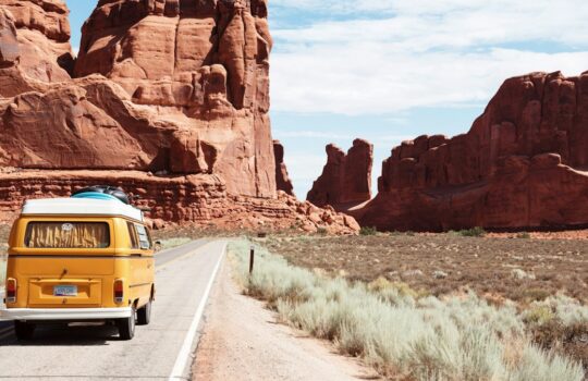 yellow Volkswagen van on road