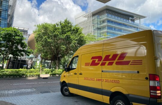 yellow van parked on sidewalk during daytime